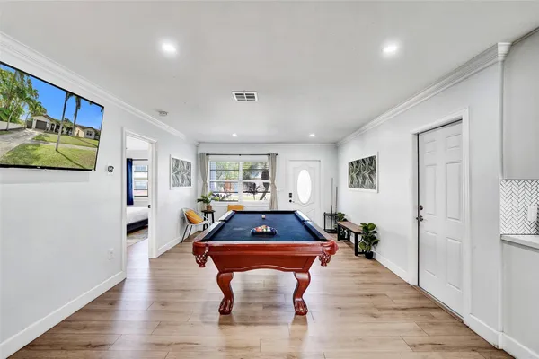 a room with furniture and wooden floor
