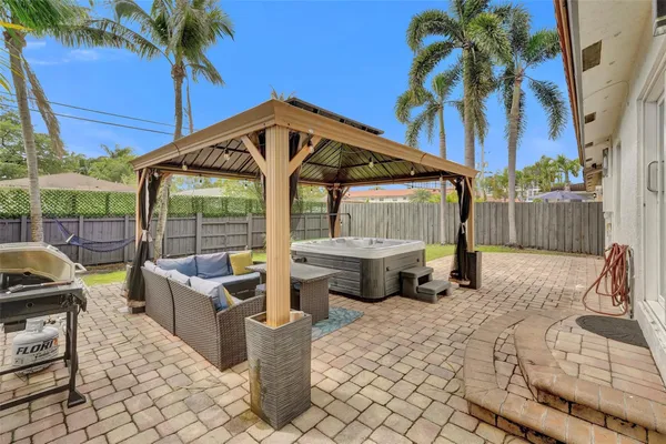 a view of a chair and tables in the patio