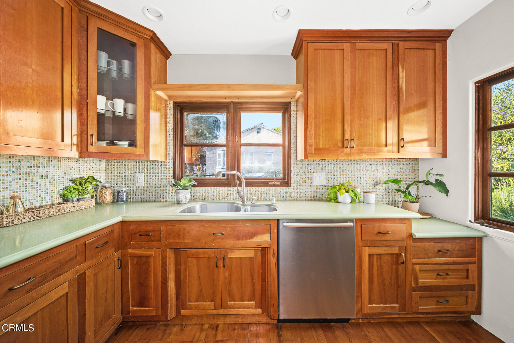2864 Sterling Place Altadena, CA 91001 - Photo 11 of 28 a kitchen with stainless steel appliances granite countertop wooden cabinets a sink and dishwasher with wooden floor