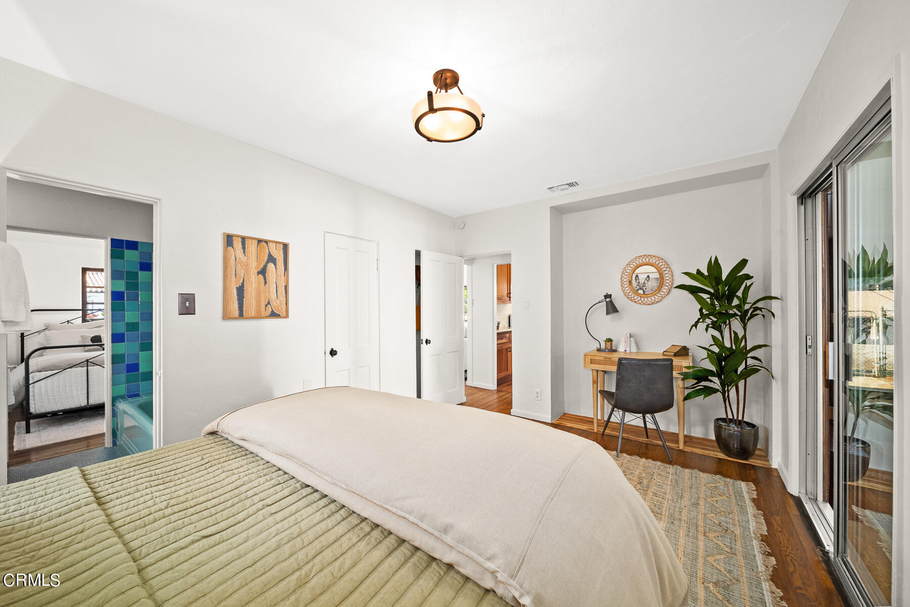 2864 Sterling Place Altadena, CA 91001 - Photo 15 of 28 a bedroom with a bed and a chandelier