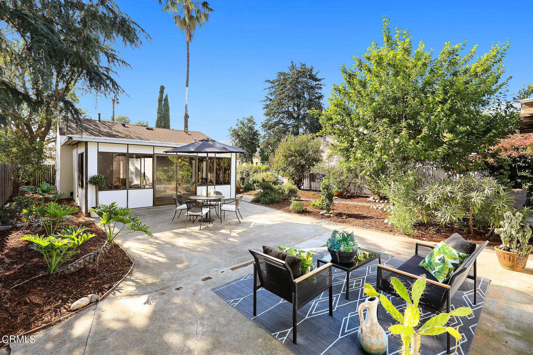 2864 Sterling Place Altadena, CA 91001 - Photo 19 of 28 a view of a patio with table and chairs under an umbrella