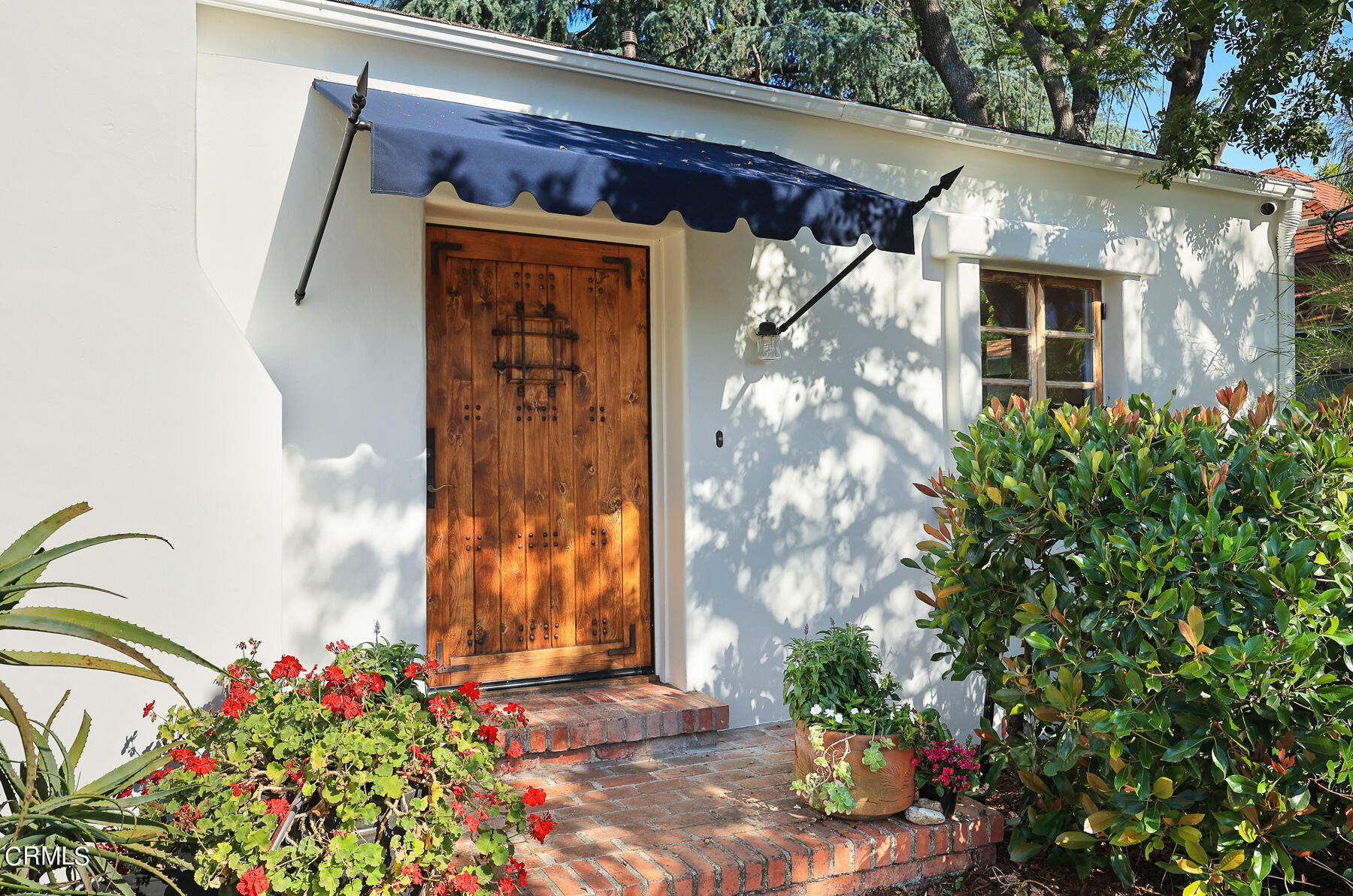 2864 Sterling Place Altadena, CA 91001 - Photo 2 of 28 a front view of a house with a garden