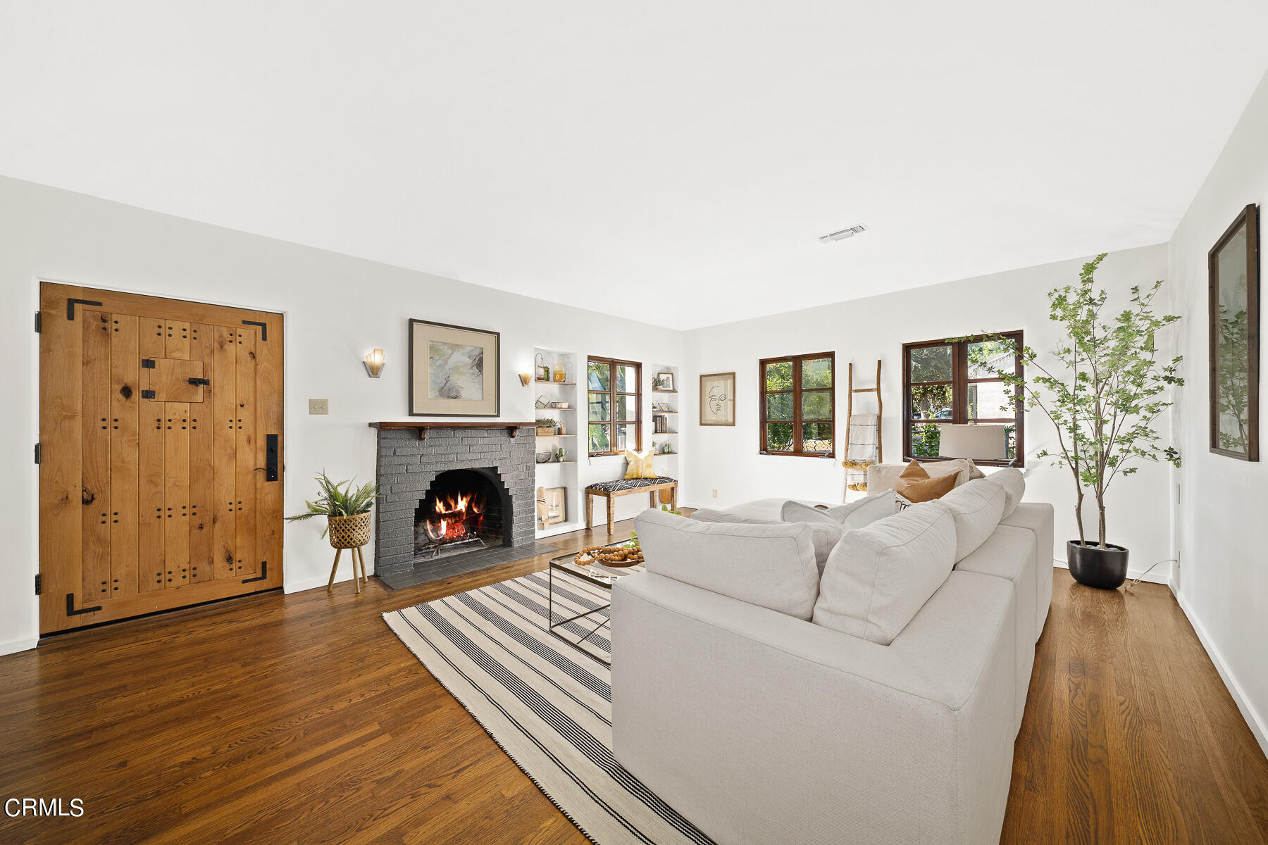 2864 Sterling Place Altadena, CA 91001 - Photo 7 of 28 a living room with furniture a fireplace and a flat screen tv