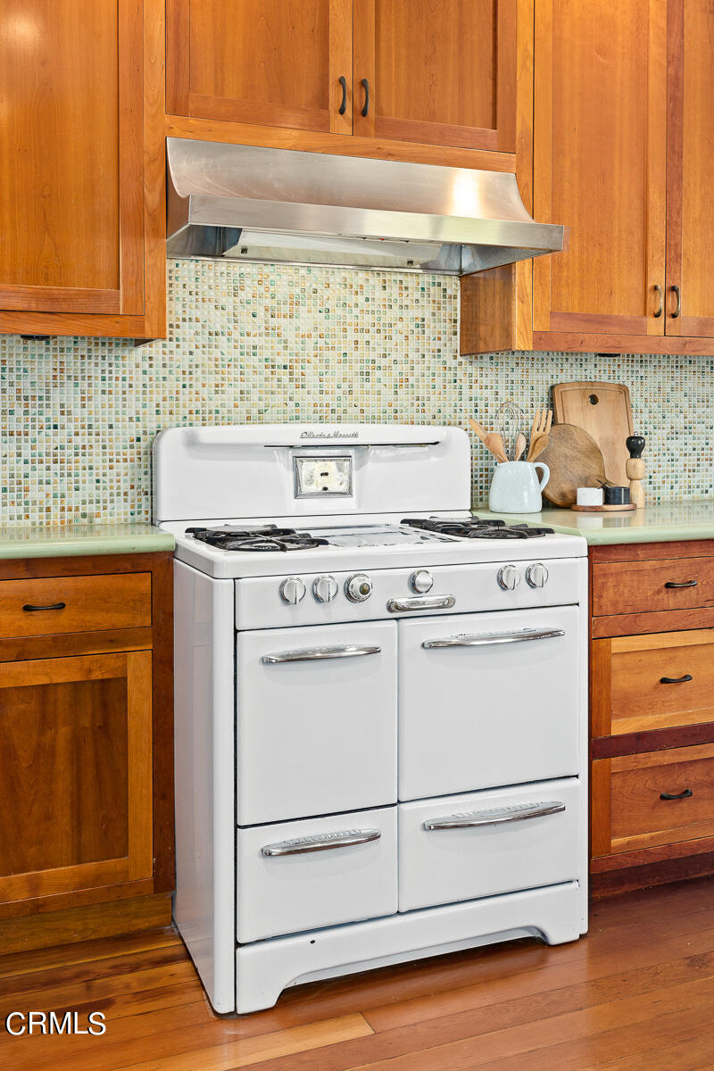 2864 Sterling Place Altadena, CA 91001 - Photo 10 of 28 a kitchen with granite countertop white cabinets and white appliances