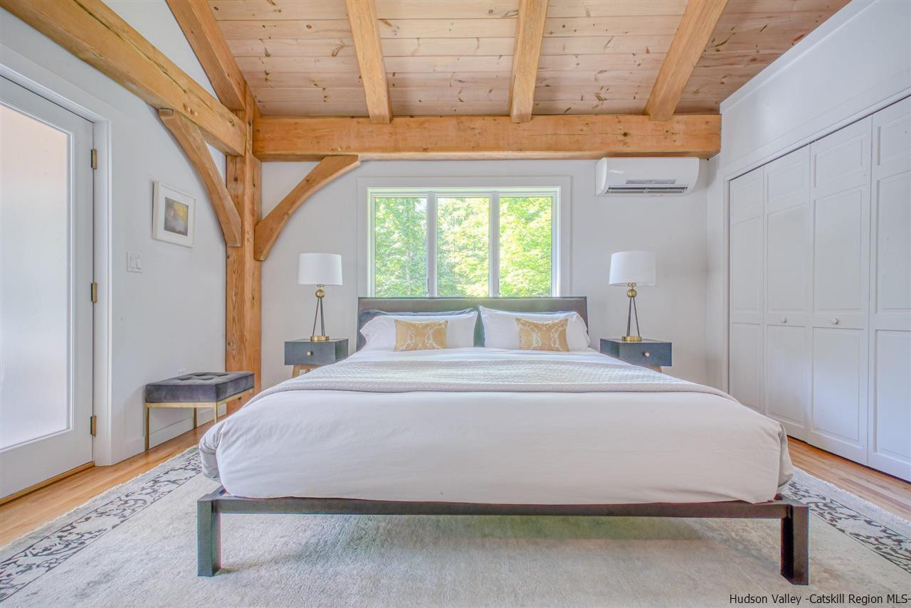 215 Sheldon Hill Road Olivebridge, NY 12461 - Photo 13 of 32 a large bed sitting in a bedroom next to a window