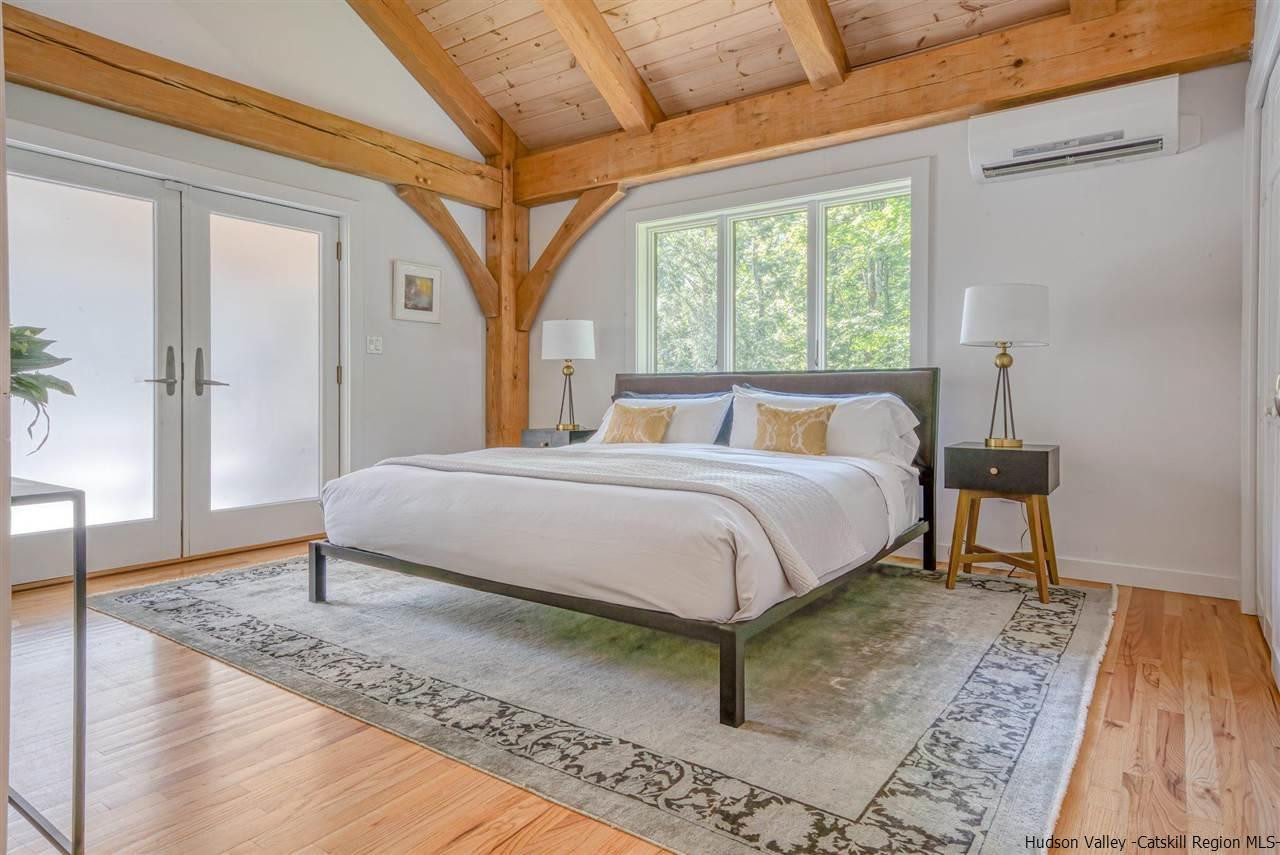 215 Sheldon Hill Road Olivebridge, NY 12461 - Photo 14 of 32 a bedroom with a bed lamp and a large window