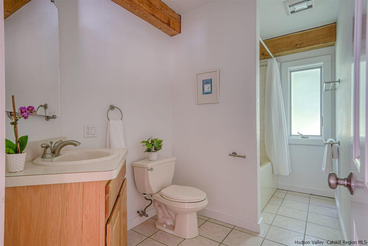 215 Sheldon Hill Road Olivebridge, NY 12461 - Photo 16 of 32 a bathroom with a sink toilet and shower