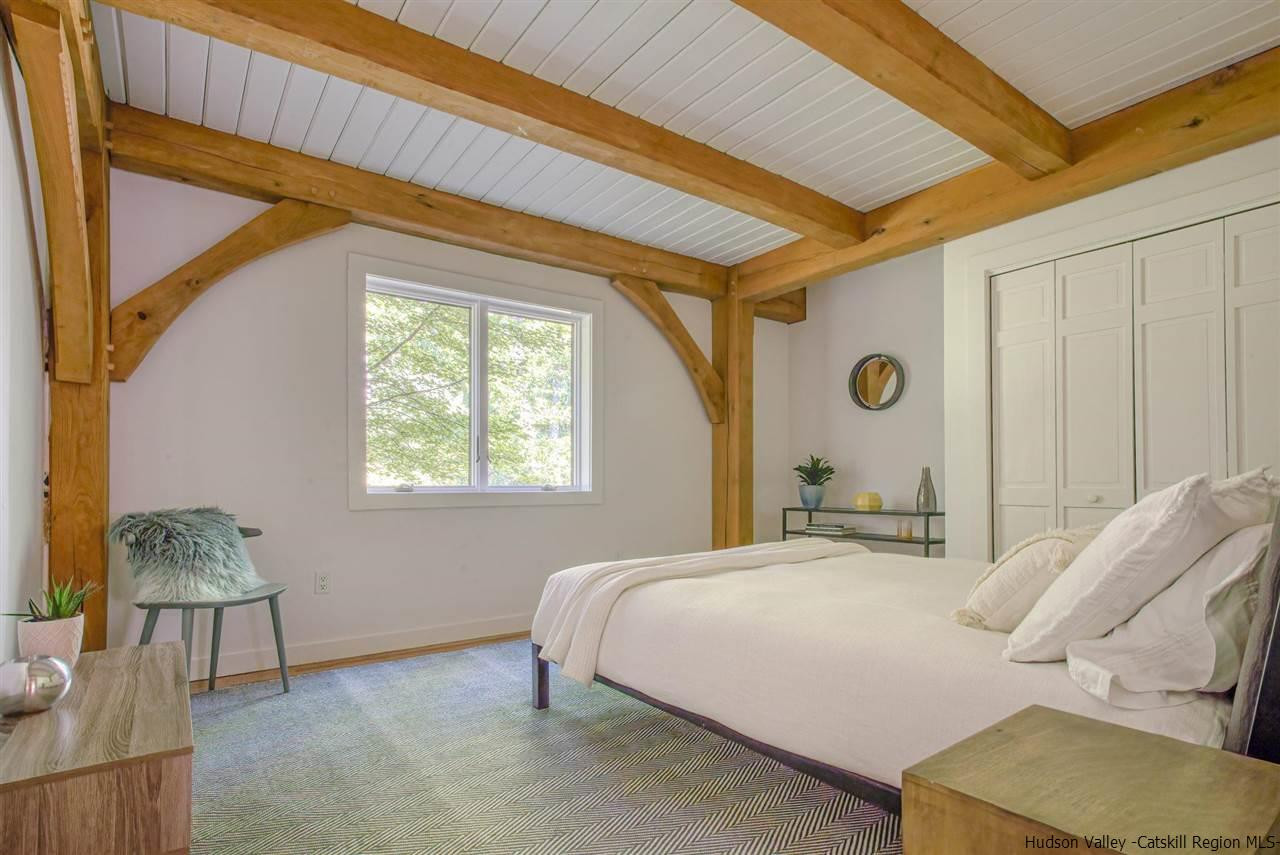 215 Sheldon Hill Road Olivebridge, NY 12461 - Photo 18 of 32 a bedroom with a bed and a chair