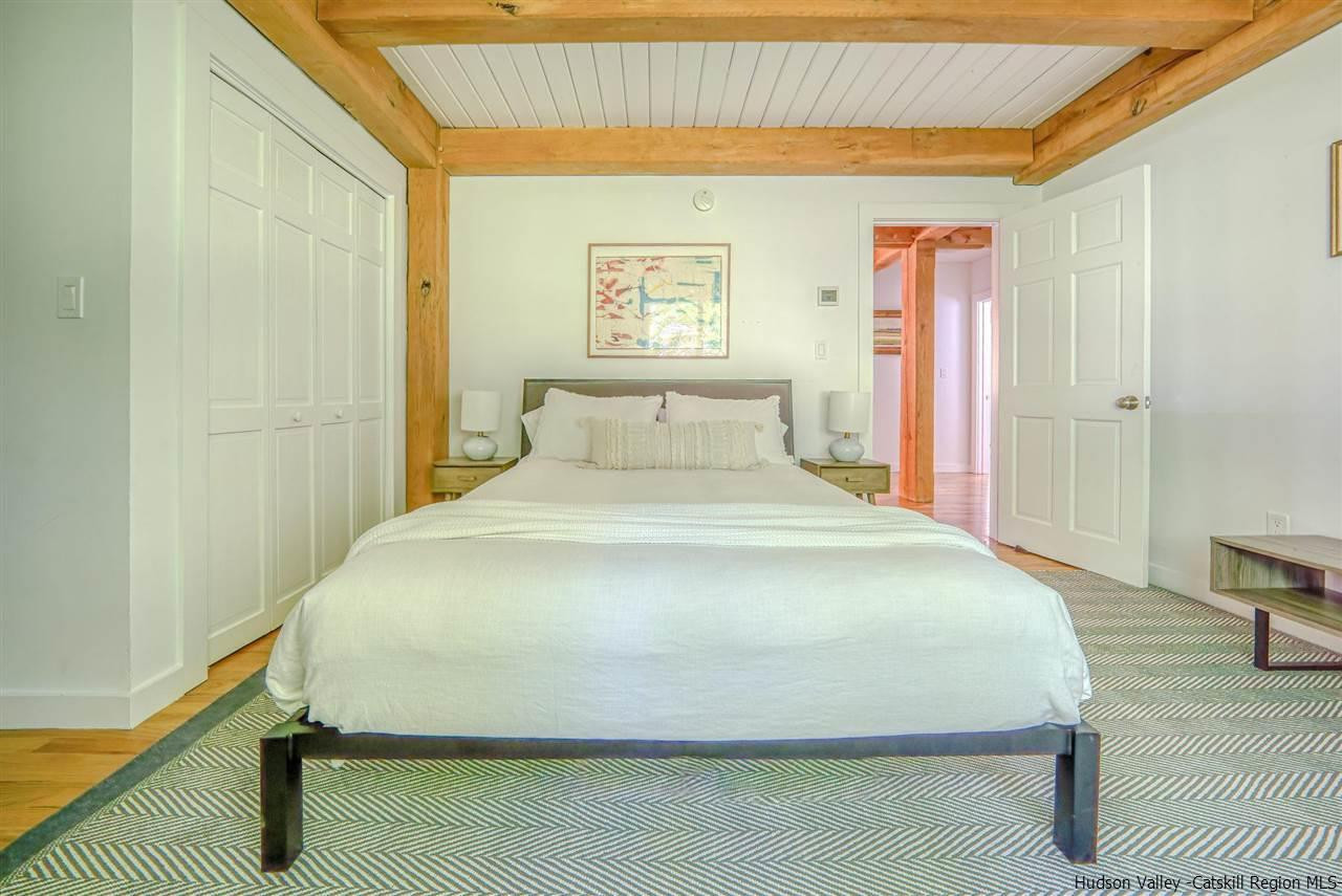 215 Sheldon Hill Road Olivebridge, NY 12461 - Photo 19 of 32 a large bed sitting in a bedroom next to a window