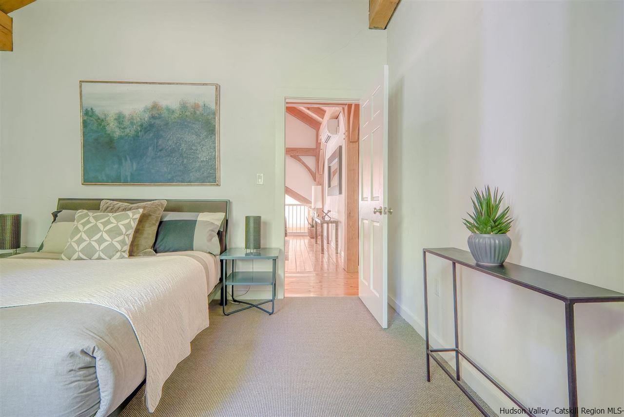 215 Sheldon Hill Road Olivebridge, NY 12461 - Photo 21 of 32 a bedroom with a bed and a painting on the wall