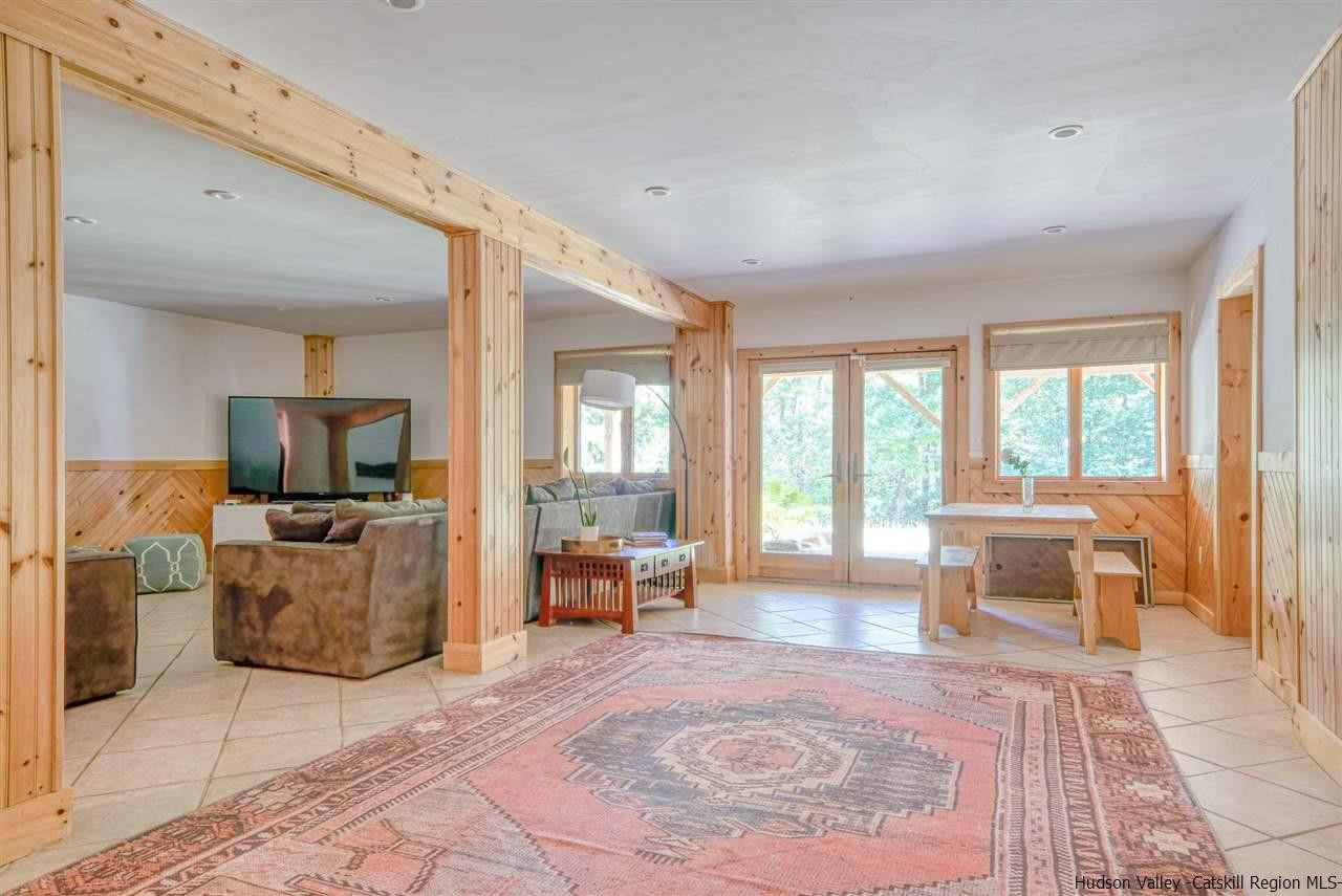215 Sheldon Hill Road Olivebridge, NY 12461 - Photo 26 of 32 a living room with furniture and a flat screen tv