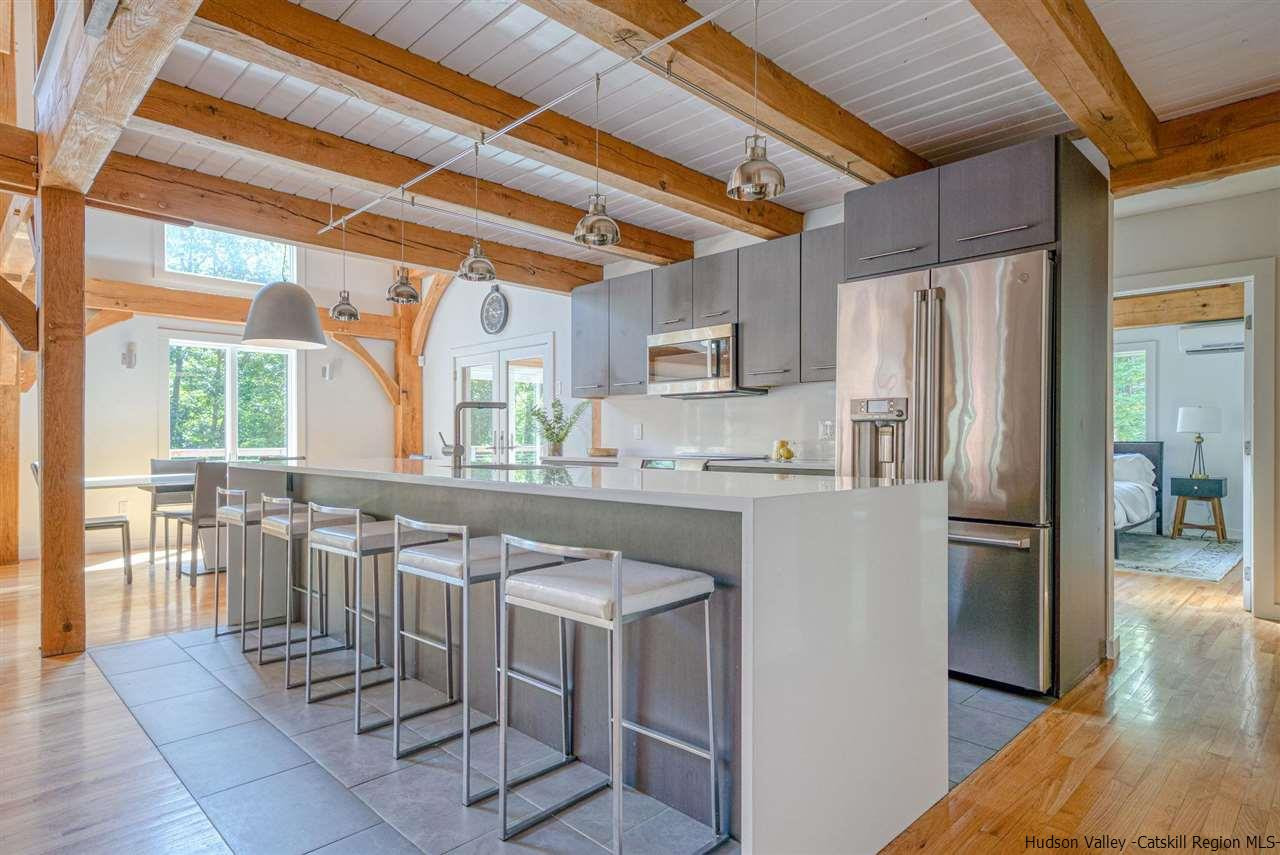 215 Sheldon Hill Road Olivebridge, NY 12461 - Photo 4 of 32 a kitchen with stainless steel appliances a refrigerator and a stove