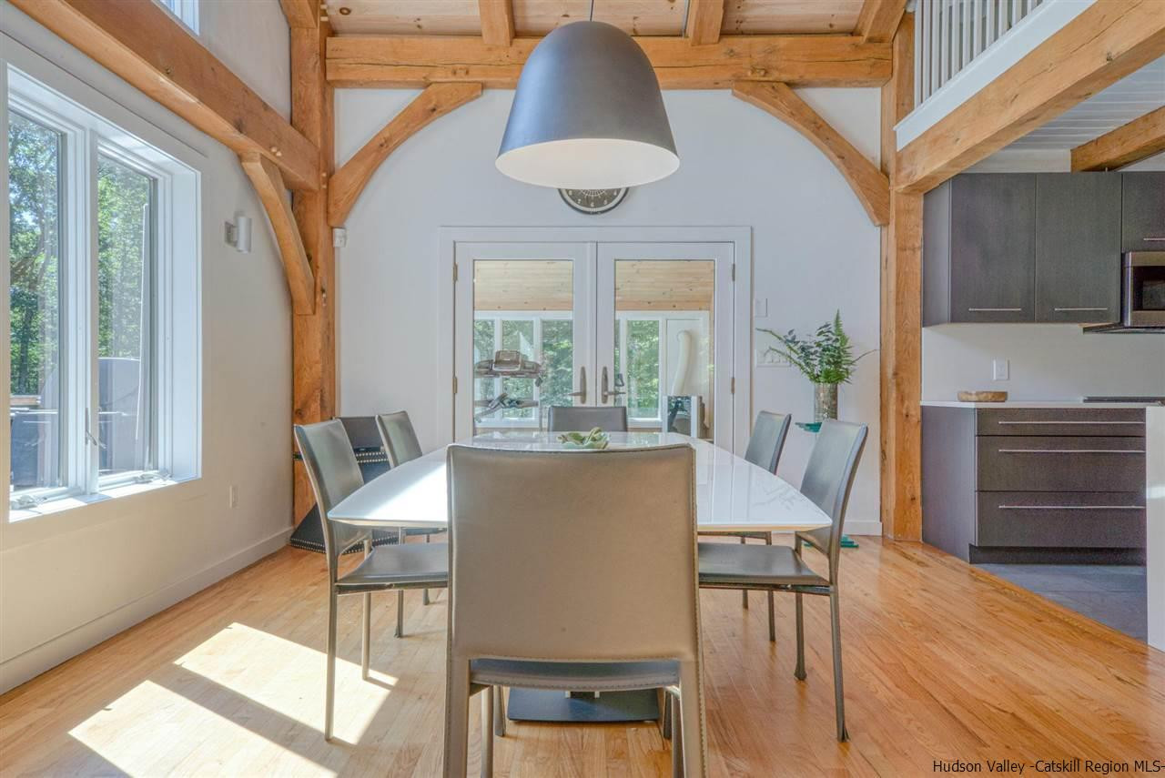 215 Sheldon Hill Road Olivebridge, NY 12461 - Photo 7 of 32 a view of a dining room with furniture and wooden floor