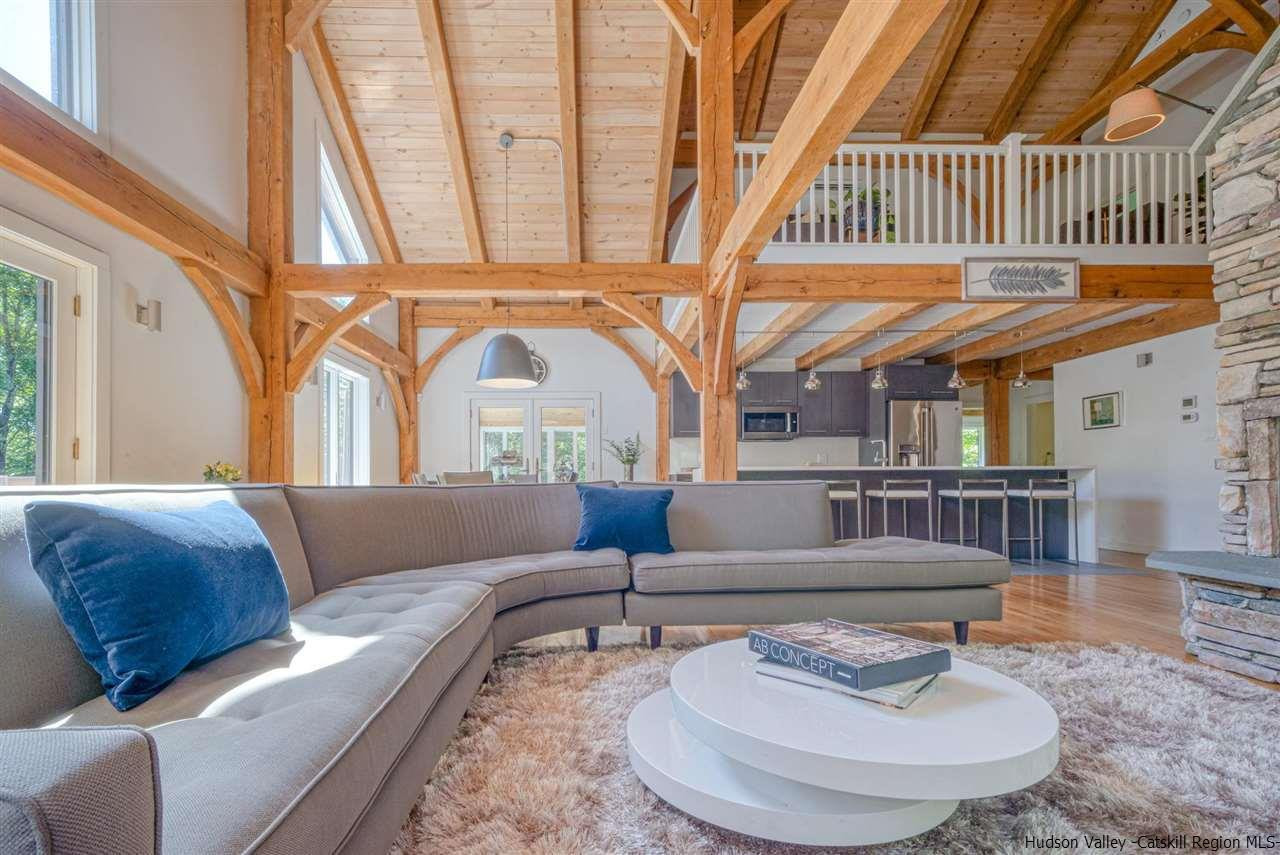 215 Sheldon Hill Road Olivebridge, NY 12461 - Photo 9 of 32 a living room with furniture and a floor to ceiling window