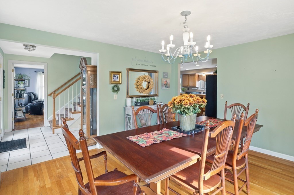 5 Kayla Lane Dudley, MA 01571 - Photo 11 of 32 a view of a dining room with furniture and chandelier
