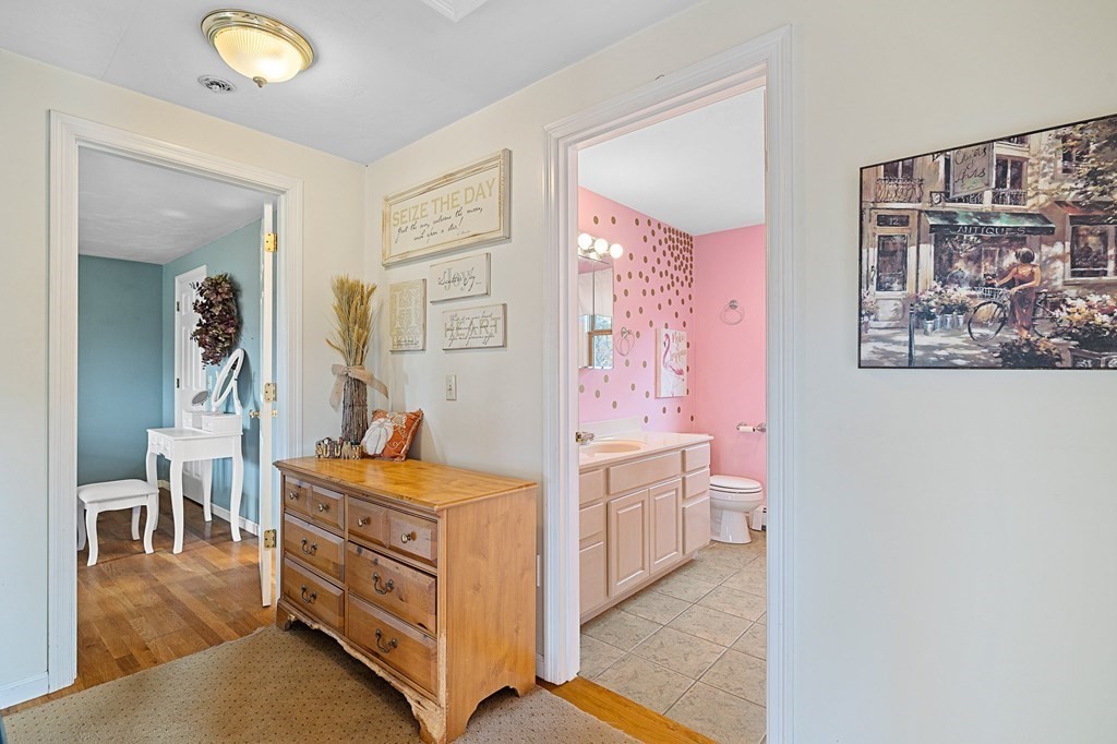 5 Kayla Lane Dudley, MA 01571 - Photo 17 of 32 a bed room with a bed and a chair