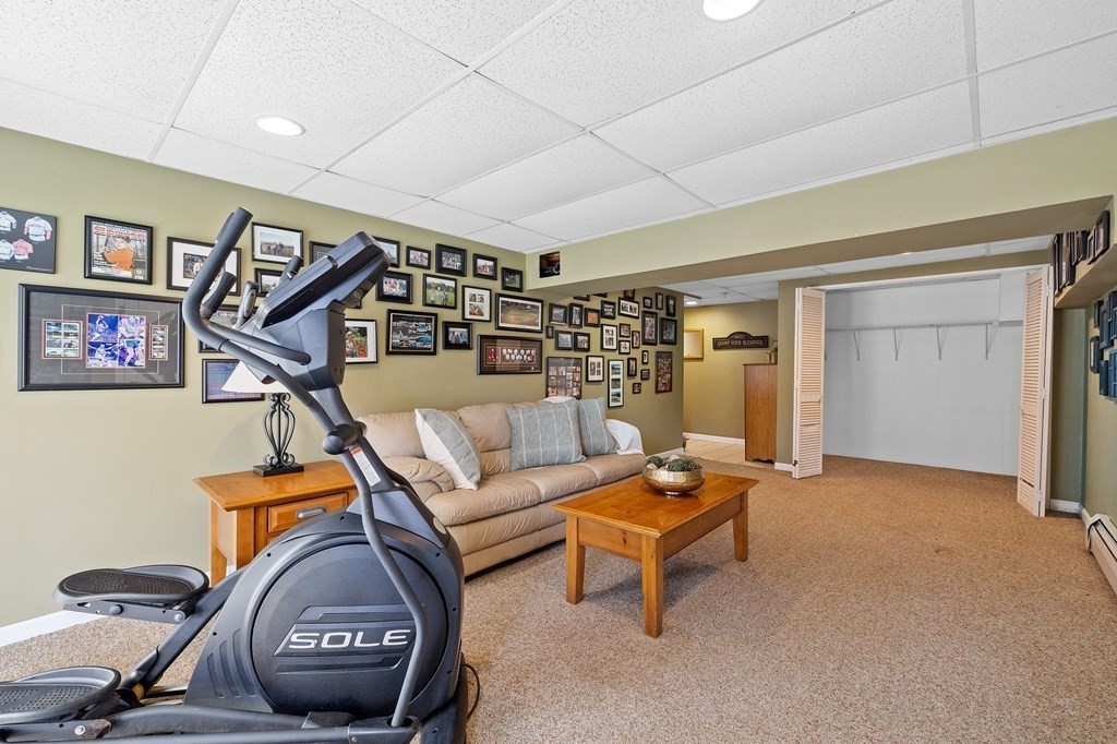 5 Kayla Lane Dudley, MA 01571 - Photo 26 of 32 a living room with furniture a rug and a window