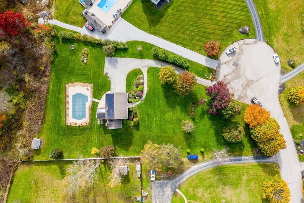 5 Kayla Lane Dudley, MA 01571 - Photo 31 of 32 a swimming pool with trees in the background