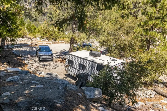 a view of a backyard with sitting area