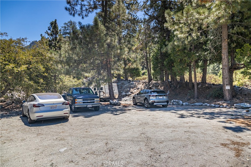 0 Quercus Lane Forest Falls, CA 92339 - Photo 7 of 24 a view of a patio with a table and chairs under an umbrella