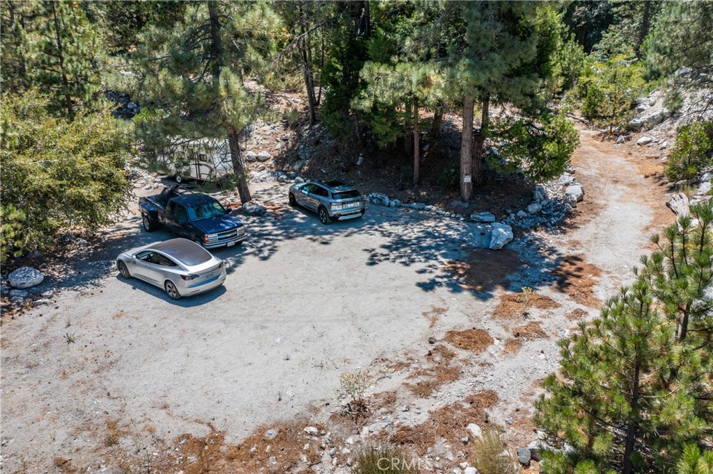 0 Quercus Lane Forest Falls, CA 92339 - Photo 9 of 24 a backyard of a house with barbeque oven and trees