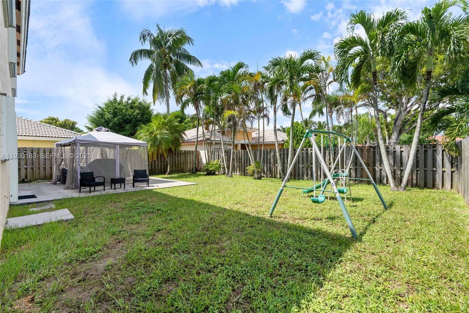 14152 Southwest 154th Court Miami, FL 33196 - Photo 18 of 33 a view of backyard with trampoline