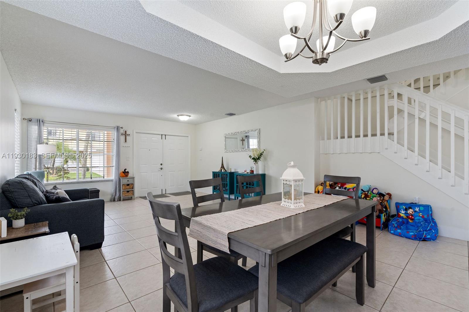 14152 Southwest 154th Court Miami, FL 33196 - Photo 4 of 33 a view of a dining room with furniture