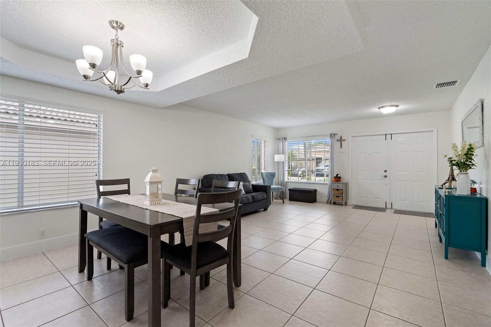 14152 Southwest 154th Court Miami, FL 33196 - Photo 7 of 33 a view of a dining room with furniture