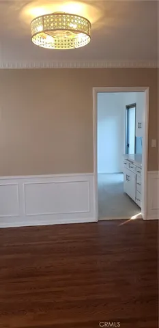 a kitchen with granite countertop a sink stove and cabinets