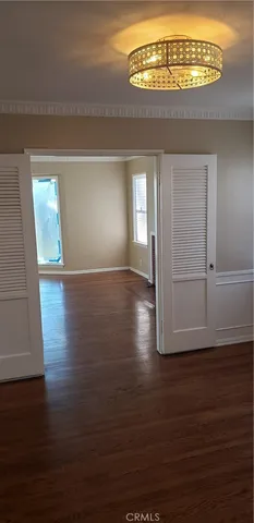 a kitchen with granite countertop white cabinets and sink