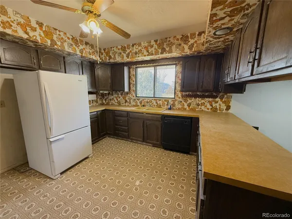 a kitchen with stainless steel appliances a refrigerator and a stove