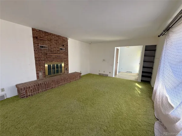 a view of livingroom with furniture and staircase