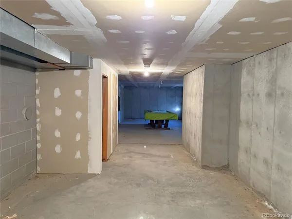 a view of a room with lots of gym equipment