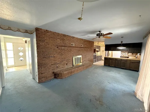 a view of a livingroom with furniture and window