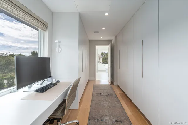 a bathroom with a granite countertop sink mirror bathtub and toilet