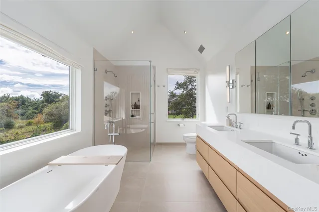 a white bath tub sitting next to a window