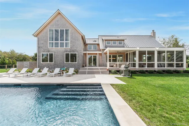 a front view of a house with swimming pool