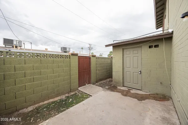 a bathroom with a shower and a sink