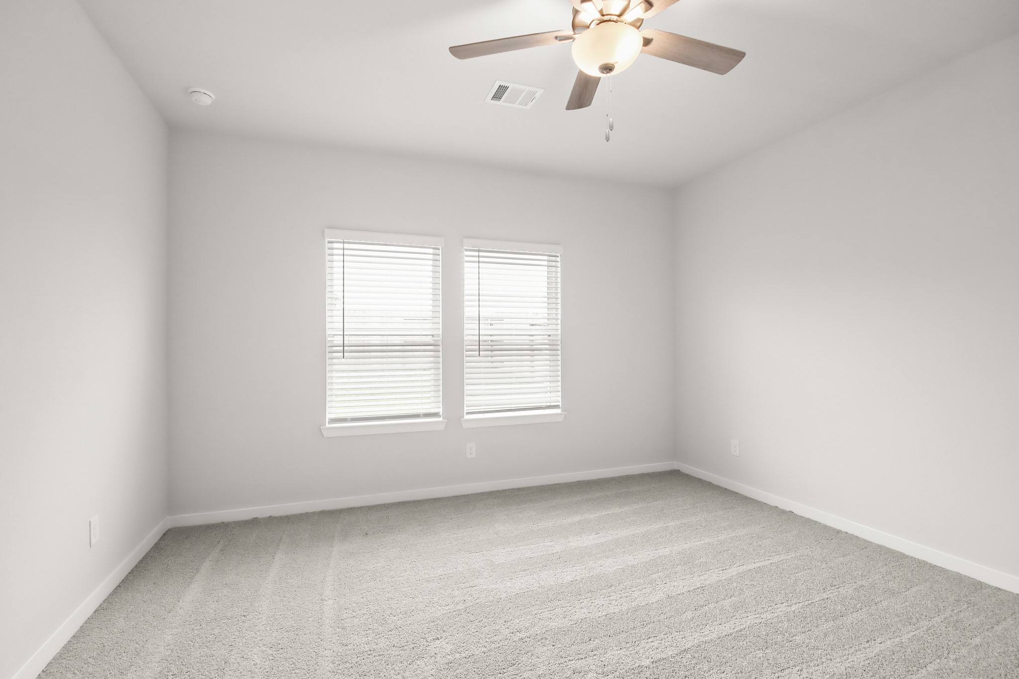 529 Wax Myrtle Way Hockley, TX 77447 - Photo 11 of 26 an empty room with a window and a fan
