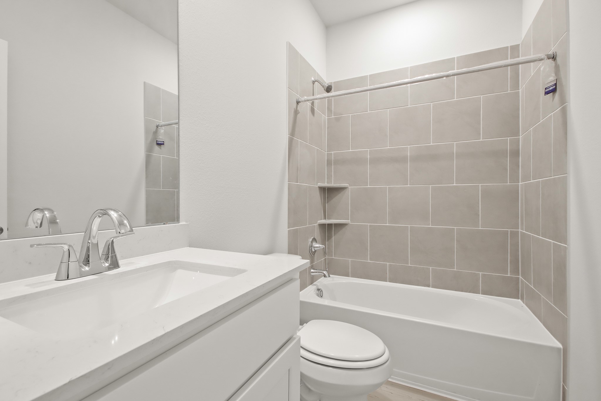 529 Wax Myrtle Way Hockley, TX 77447 - Photo 15 of 26 a bathroom with a bathtub shower sink vanity and toilet