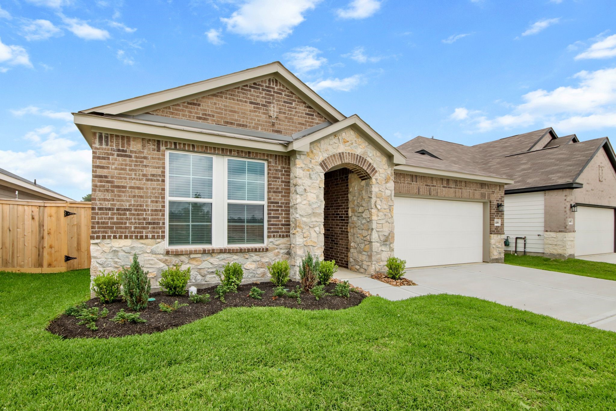 529 Wax Myrtle Way Hockley, TX 77447 - Photo 2 of 26 a front view of a house with a yard and garage
