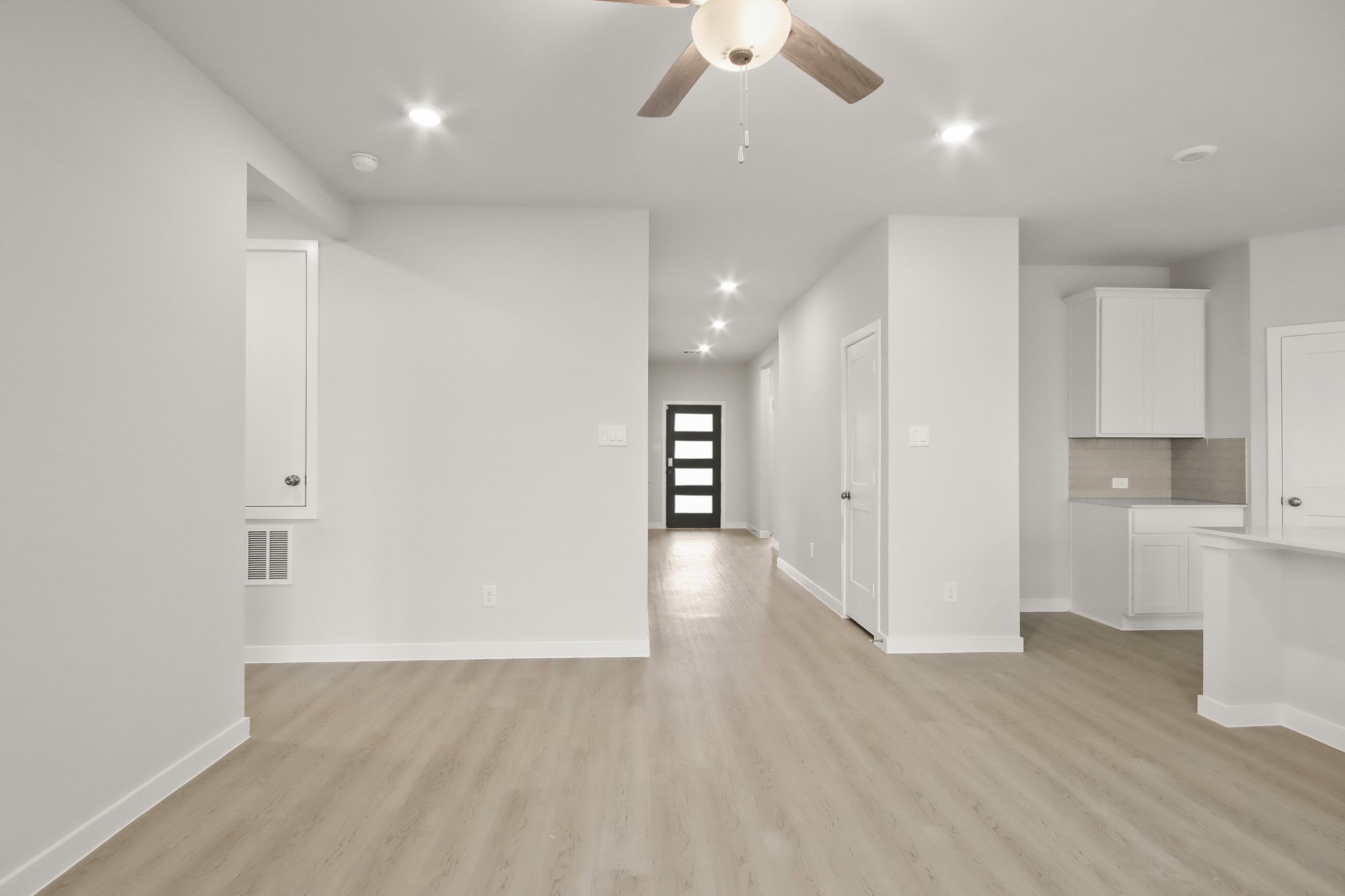 529 Wax Myrtle Way Hockley, TX 77447 - Photo 7 of 26 a view of a kitchen and a sink wooden floor windows