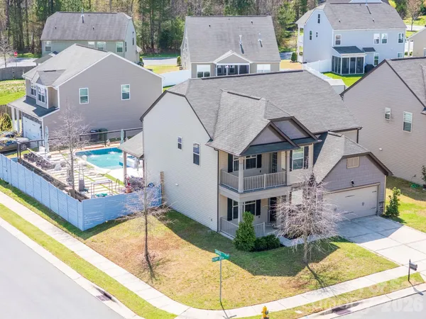 an aerial view of a house with swimming pool