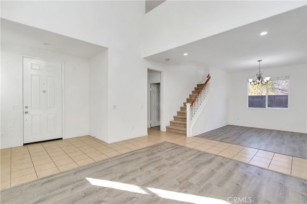 34020 Crenshaw Street Beaumont, CA 92223 - Photo 12 of 36 a view of an entryway with wooden floor