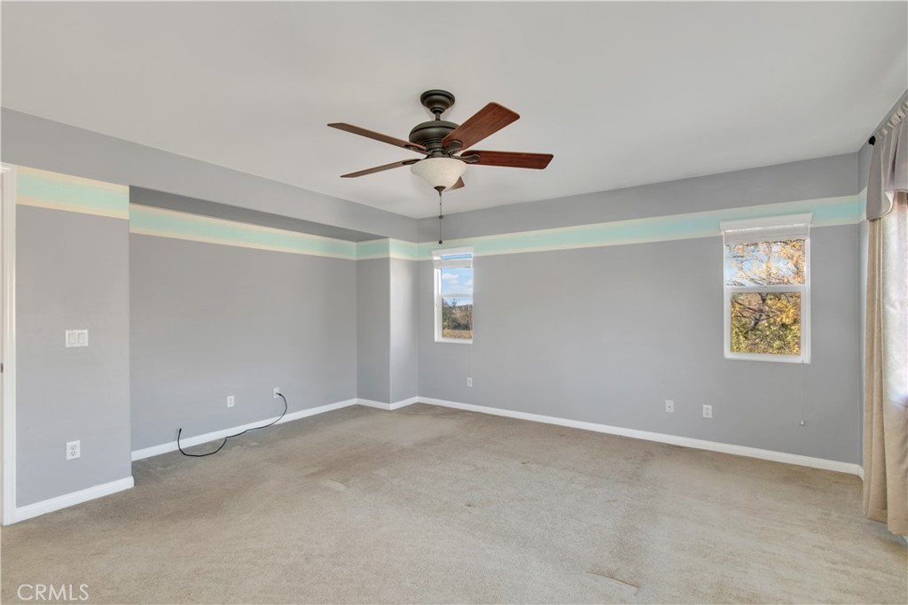 34020 Crenshaw Street Beaumont, CA 92223 - Photo 18 of 36 a view of room with window and ceiling fan