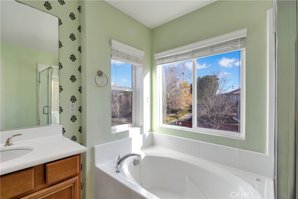 34020 Crenshaw Street Beaumont, CA 92223 - Photo 22 of 36 a bathroom with a bathtub and a sink