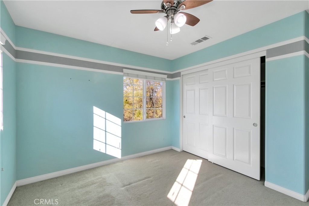 34020 Crenshaw Street Beaumont, CA 92223 - Photo 25 of 36 a view of empty room with window and ceiling fan