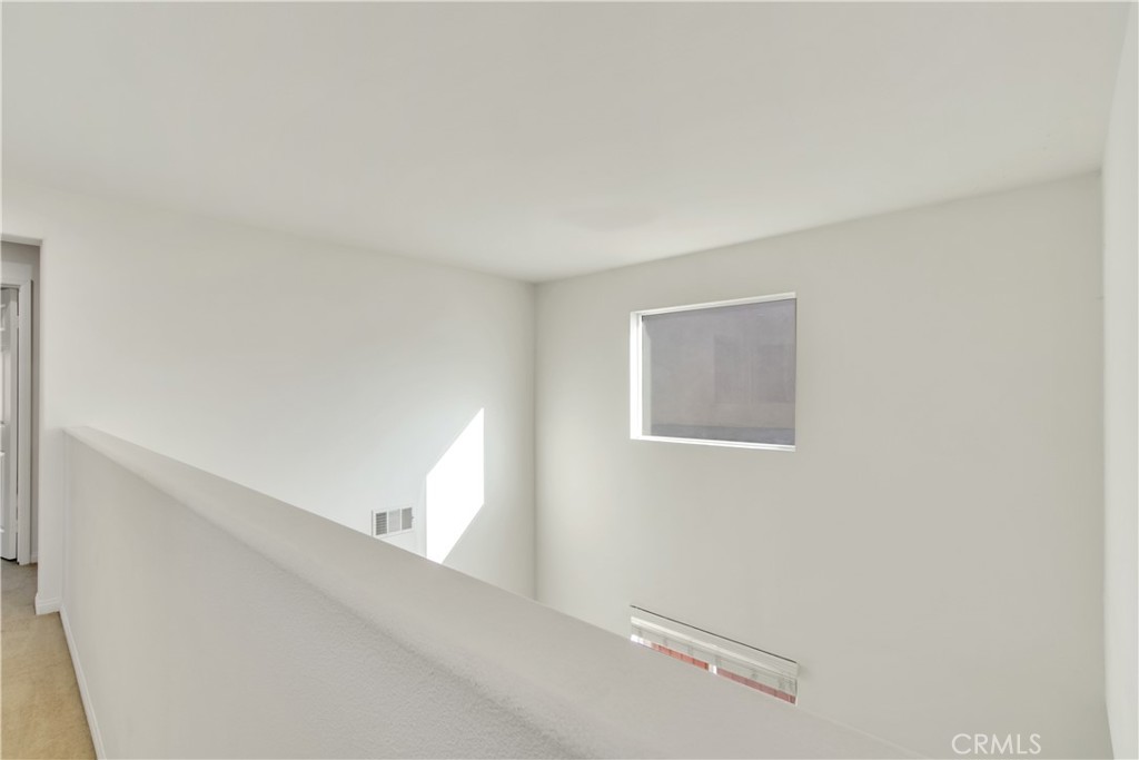 34020 Crenshaw Street Beaumont, CA 92223 - Photo 32 of 36 a view of a hallway with a white wall