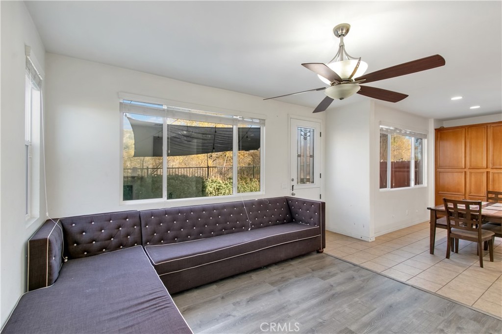 34020 Crenshaw Street Beaumont, CA 92223 - Photo 10 of 36 a living room with furniture and a large window
