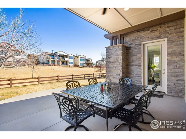 a view of swimming pool with an outdoor seating